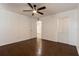 A large bedroom featuring hardwood floors, ceiling fan, and closet space at 4411 Shady Terrace Ln # 213, Tampa, FL 33613