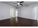 Open bedroom with modern ceiling fan and sleek dark wood flooring, offering a tranquil retreat at 4411 Shady Terrace Ln # 213, Tampa, FL 33613