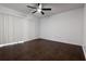 Spacious bedroom with sleek ceiling fan and modern dark wood flooring perfect for comfortable living at 4411 Shady Terrace Ln # 213, Tampa, FL 33613