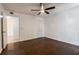 Large bedroom boasts wood floors, ceiling fan, and closet space at 4411 Shady Terrace Ln # 213, Tampa, FL 33613