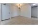 Open dining area featuring tile flooring and a decorative light fixture at 4411 Shady Terrace Ln # 213, Tampa, FL 33613