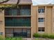 Exterior showing multiple screened patios on a multi-story building at 4411 Shady Terrace Ln # 213, Tampa, FL 33613