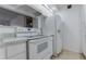 Bright kitchen featuring white appliances, cabinets, and light countertops for a clean, functional space at 4411 Shady Terrace Ln # 213, Tampa, FL 33613