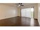 Bright, open living area with hard floors and access to the balcony at 4411 Shady Terrace Ln # 213, Tampa, FL 33613