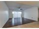 Spacious living room featuring sliding glass doors to the balcony and hard flooring at 4411 Shady Terrace Ln # 213, Tampa, FL 33613