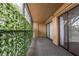 Screened in porch with sliding glass doors and decorative leafy privacy screen at 4411 Shady Terrace Ln # 213, Tampa, FL 33613