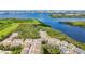 Aerial view of the community showcasing homes nestled among trees, ponds, and lush greenery at 4567 Tuscan Loon Dr, Tampa, FL 33619
