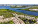 Aerial view of a waterfront residential community with beautiful water views and lush green landscaping at 4567 Tuscan Loon Dr, Tampa, FL 33619
