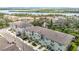 Aerial view of townhomes showing proximity to the water and meticulously landscaped yards at 4567 Tuscan Loon Dr, Tampa, FL 33619