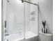 Bathroom featuring a shower with white subway tile and a glass enclosure at 4567 Tuscan Loon Dr, Tampa, FL 33619