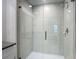 Modern bathroom featuring a sleek glass shower with gray tile surround, and a premium shower head at 4567 Tuscan Loon Dr, Tampa, FL 33619