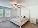Bright and airy bedroom with large windows, plush carpet, and modern ceiling fan at 4567 Tuscan Loon Dr, Tampa, FL 33619