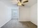 Spacious bedroom with neutral carpet, fan, and one window providing natural light at 4567 Tuscan Loon Dr, Tampa, FL 33619