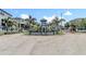 Community entrance with lush landscaping and a decorative sign, welcoming residents to Palm River at 4567 Tuscan Loon Dr, Tampa, FL 33619