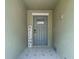 Charming entryway features decorative tile flooring and a welcoming welcome sign at 4567 Tuscan Loon Dr, Tampa, FL 33619