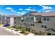 Exterior elevation of townhomes showing well-maintained landscaping and architectural details at 4567 Tuscan Loon Dr, Tampa, FL 33619
