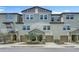 Charming townhome exterior featuring a two-car garage, stone accents, and well-maintained landscaping at 4567 Tuscan Loon Dr, Tampa, FL 33619