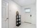 Bright entryway featuring tile floors, a convenient coat closet, and decorative accents at 4567 Tuscan Loon Dr, Tampa, FL 33619