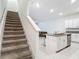 Open-concept kitchen with sleek white cabinets, granite countertops, and stainless steel appliances at 4567 Tuscan Loon Dr, Tampa, FL 33619