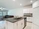 Gourmet kitchen island and stainless steel appliances offer modern convenience and style at 4567 Tuscan Loon Dr, Tampa, FL 33619