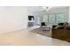 Bright living room features a neutral color palette, comfortable seating, and lots of natural light at 4567 Tuscan Loon Dr, Tampa, FL 33619