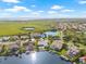 Beautiful aerial shot showcasing waterfront homes, each with a private dock, swimming pool, and manicured lawns at 5002 E Longboat Blvd, Tampa, FL 33615