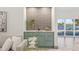 Stylish bar area featuring tile backsplash and waterfront views at 5002 E Longboat Blvd, Tampa, FL 33615