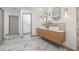 Bathroom featuring modern vanity with dual sinks, sleek fixtures and stylish tile flooring at 5002 E Longboat Blvd, Tampa, FL 33615