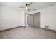 Bedroom featuring wood-look floors, closet, access door, and ceiling fan at 5002 E Longboat Blvd, Tampa, FL 33615