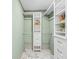 Walk-in closet features custom shelving and drawers, maximizing storage space and organization at 5002 E Longboat Blvd, Tampa, FL 33615
