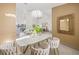 Dining room featuring modern decor and open floor plan to the living space at 5002 E Longboat Blvd, Tampa, FL 33615