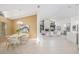 Open floorplan dining room leading to the living room and kitchen at 5002 E Longboat Blvd, Tampa, FL 33615