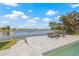 A backyard view showcasing dock with lounge chairs, ideal for relaxation at 5002 E Longboat Blvd, Tampa, FL 33615