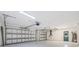 Spacious garage with automatic doors, overhead lighting and painted floors at 5002 E Longboat Blvd, Tampa, FL 33615