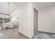 Hallway view towards bright main bedroom with access to backyard patio at 5002 E Longboat Blvd, Tampa, FL 33615