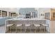 Modern kitchen featuring a large island with seating and stylish blue cabinets at 5002 E Longboat Blvd, Tampa, FL 33615
