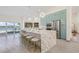 Modern kitchen with a large island, light blue cabinets, and a waterfront view at 5002 E Longboat Blvd, Tampa, FL 33615