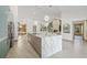 Spacious kitchen featuring an island, stainless steel appliances, and open layout into the dining and living areas at 5002 E Longboat Blvd, Tampa, FL 33615