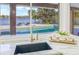 Kitchen sink featuring a view of the pool and waterfront at 5002 E Longboat Blvd, Tampa, FL 33615
