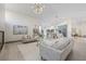 Open-concept living room with modern decor and a view of the kitchen at 5002 E Longboat Blvd, Tampa, FL 33615