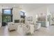 Bright and spacious living room with a modern fireplace and neutral-toned furniture at 5002 E Longboat Blvd, Tampa, FL 33615