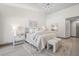 Main bedroom with high ceilings, modern light fixture and décor, neutral colors and lots of light at 5002 E Longboat Blvd, Tampa, FL 33615