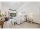 Bright main bedroom with neutral tones, modern lighting, and access to the backyard at 5002 E Longboat Blvd, Tampa, FL 33615