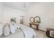 Comfortable main bedroom with modern lighting and decor, neutral color scheme and bright light at 5002 E Longboat Blvd, Tampa, FL 33615
