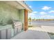 Outdoor kitchen area equipped with stainless steel grill overlooking the water at 5002 E Longboat Blvd, Tampa, FL 33615