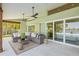 Inviting outdoor patio with comfortable seating, ceiling fans, and scenic waterfront views at 5002 E Longboat Blvd, Tampa, FL 33615