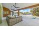 Beautiful outdoor patio overlooking the pool and waterfront, featuring comfortable seating at 5002 E Longboat Blvd, Tampa, FL 33615