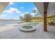 Stunning outdoor pool area with a jacuzzi, waterfront views, and lounge chairs at 5002 E Longboat Blvd, Tampa, FL 33615
