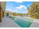 A pristine pool and spa overlook the tranquil waterfront at 5002 E Longboat Blvd, Tampa, FL 33615