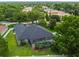 This house features a screen-enclosed pool surrounded by well-manicured landscaping at 505 Vintage Way, Brandon, FL 33511